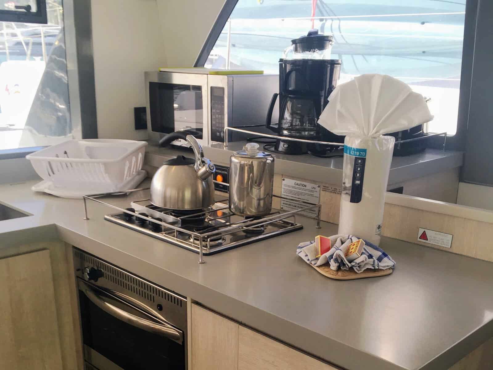 charter bareboat galley with oven, stove, microwave, coffee and tea kettle