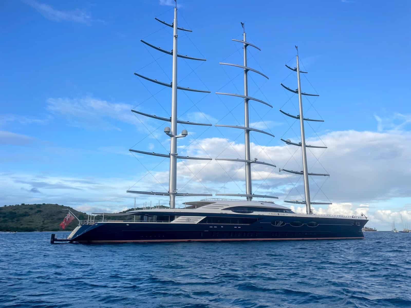 ultra-luxury sailboat with 3 masts anchored in the Caribbean
