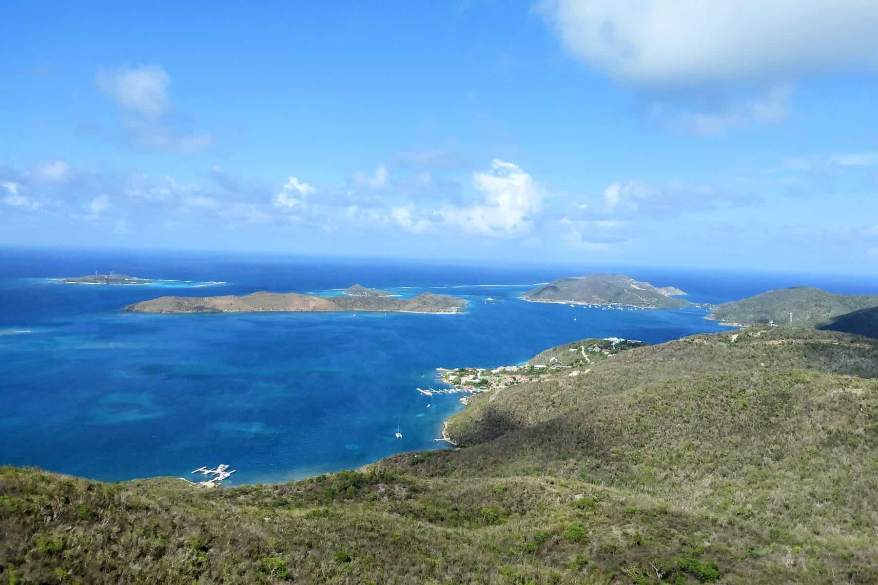 View overlooking the North Sound, Virgin Gorda, BVI with green hills and bright blue water and surrounding islands