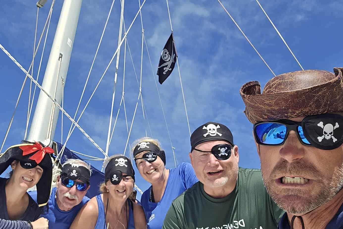 Group of sailing wearing pirate attire