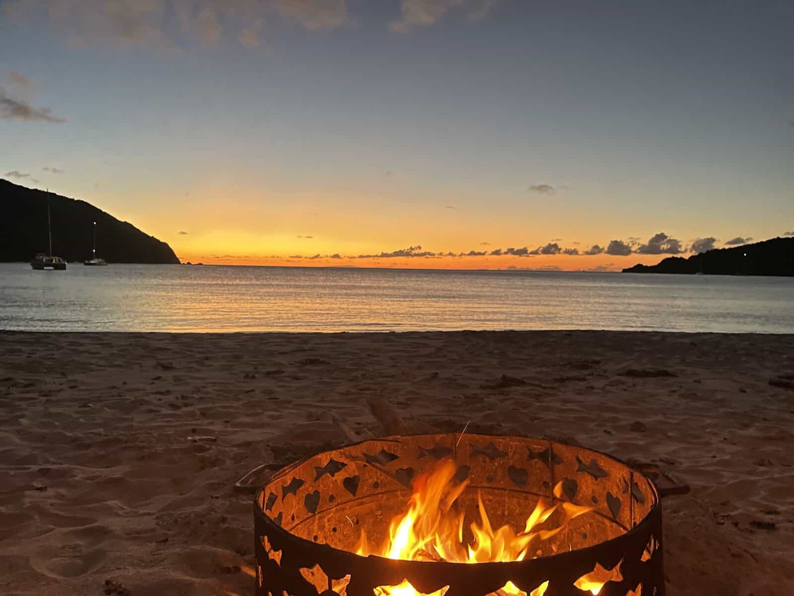 Bonfire on beach after sunset on Brewers Bay, Tortola British Virgin Islands