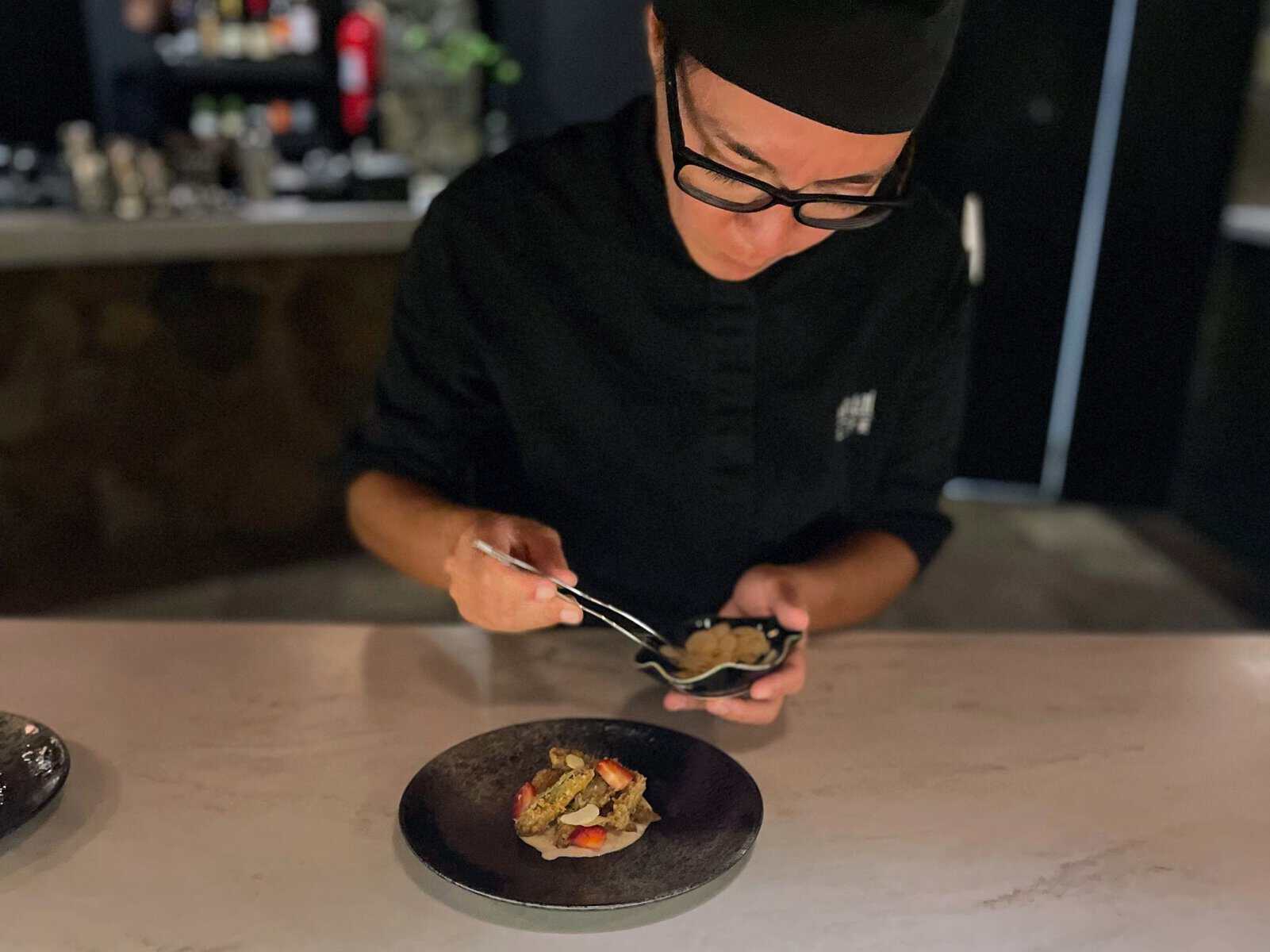 chef plating food at an Omakase experience in the British Virgin Islands