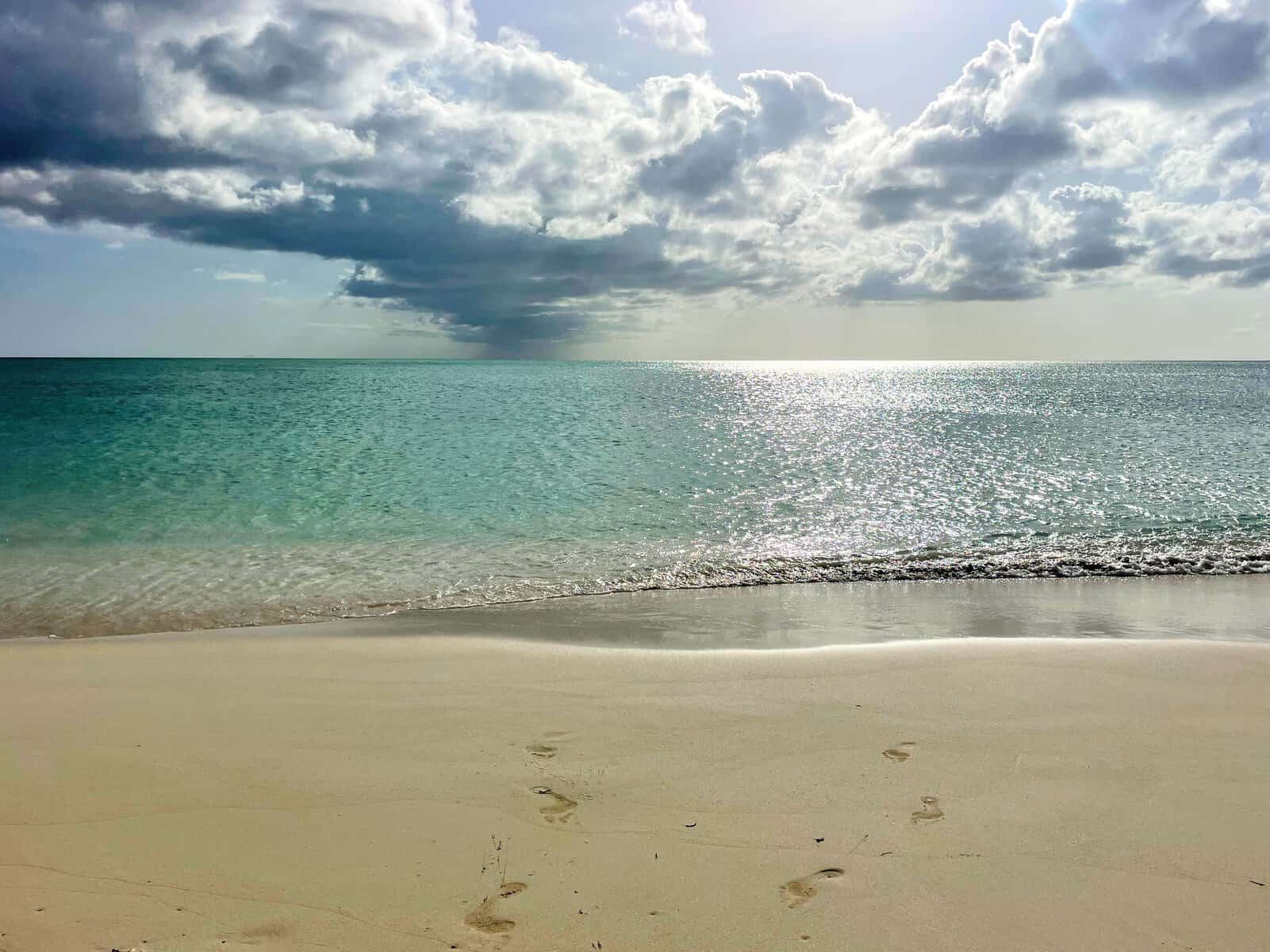 sun reflecting off ocean and beach