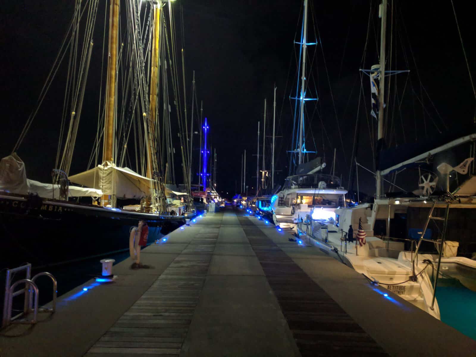 boats docked at a marina at night in the Virgin Islands