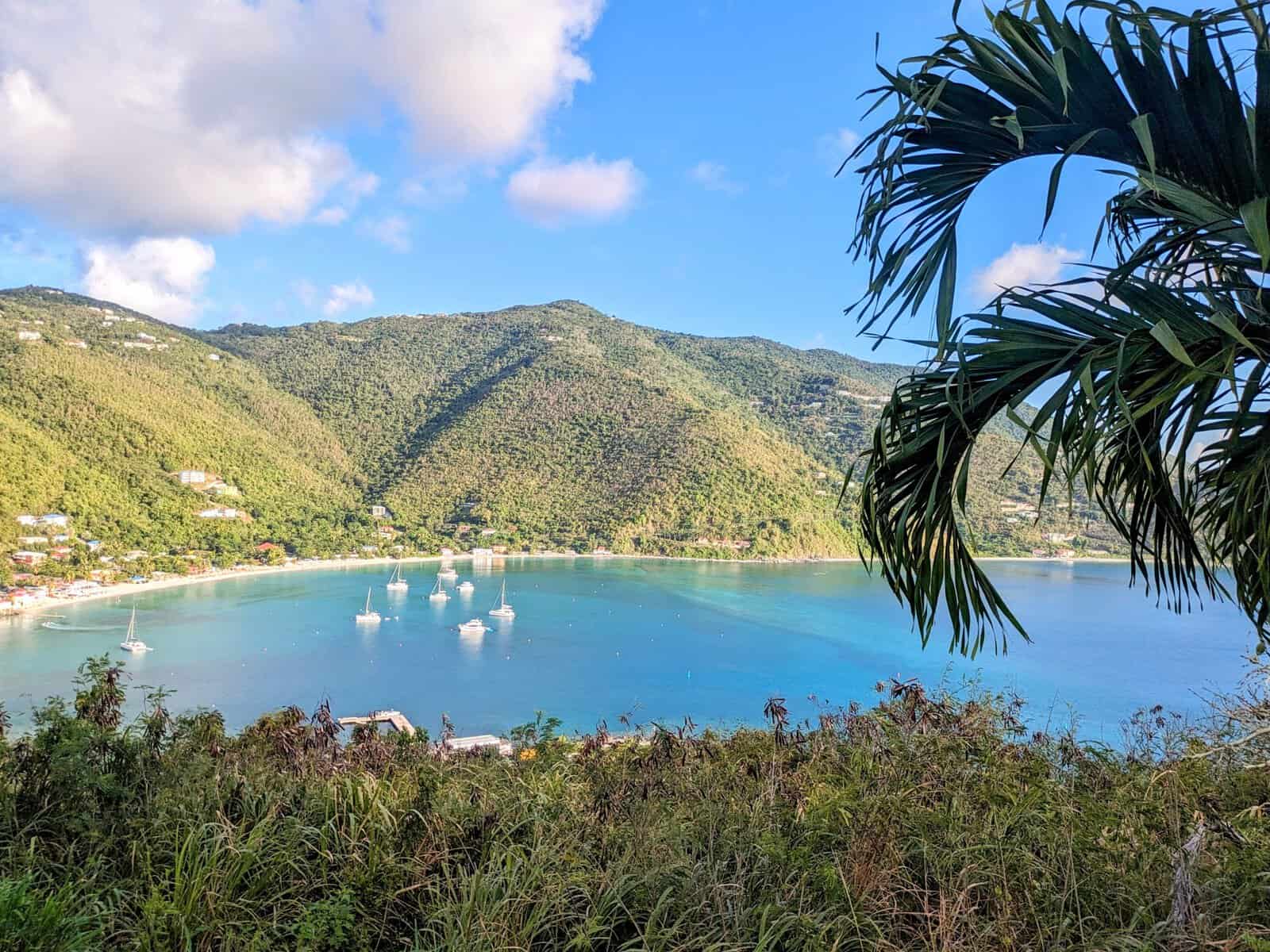 Cane Garden Bay, Tortola. turquoise blue water with green hills surrounding calm protected bay