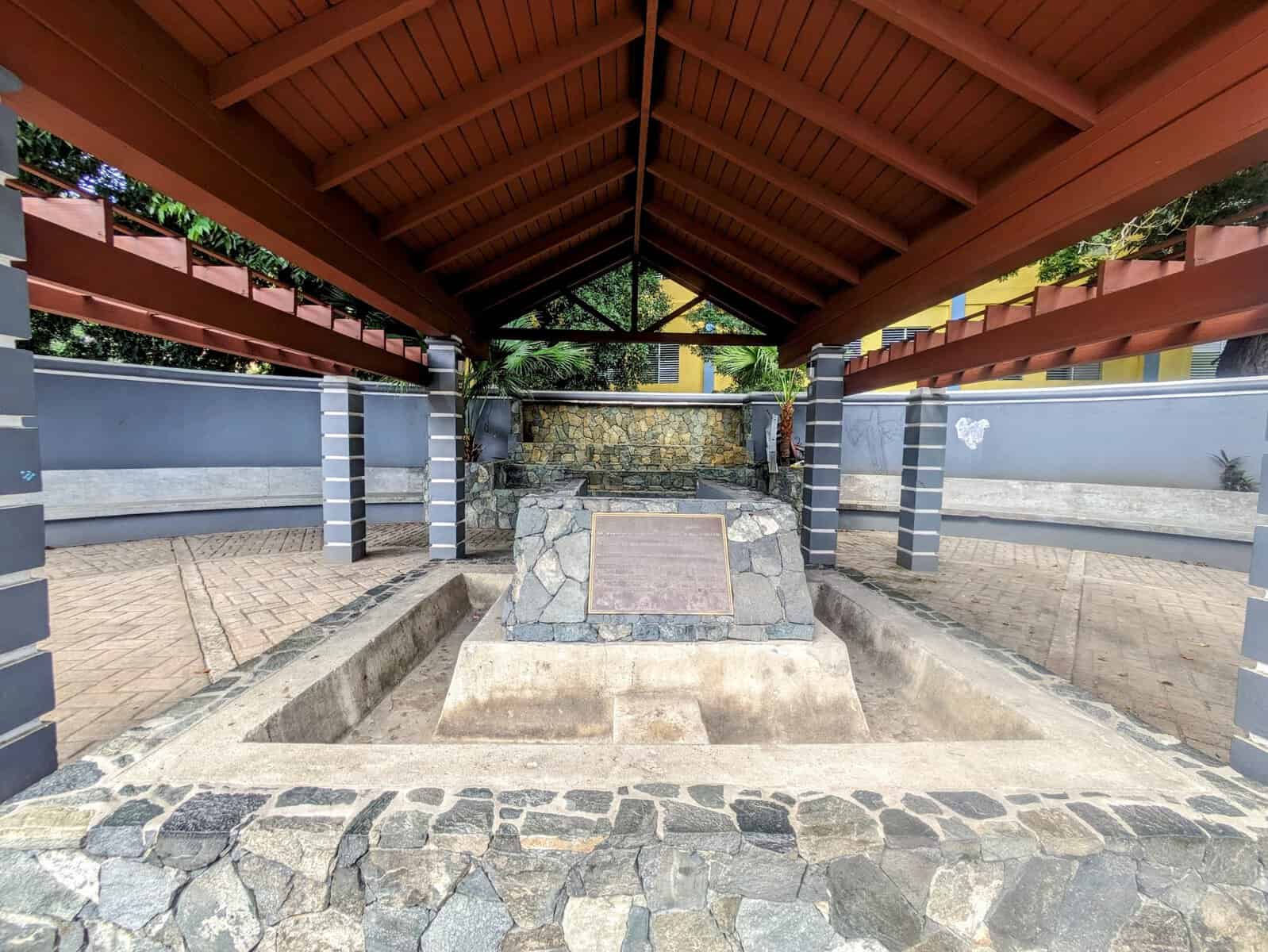 historic Sunday morning well on Tortola, stone structure with plaque
