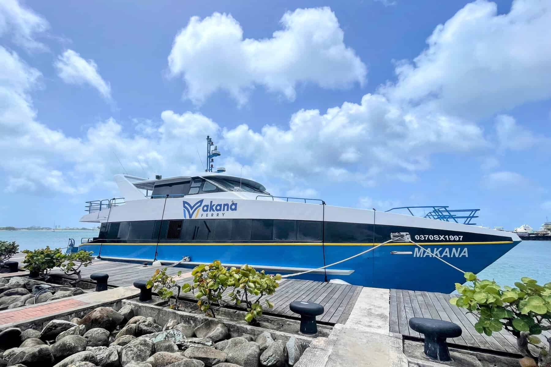 large blue and white ferry for St. Barts at the dock in St. Martin in the caribbean