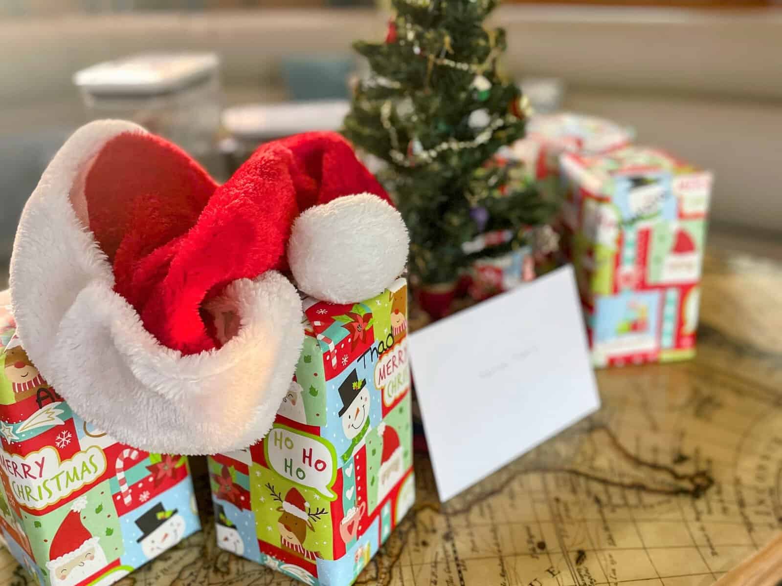 Christmas gifts with tabletop tree and santa hat on a crewed yacht charter in the Caribbean