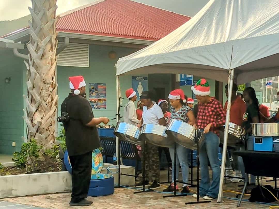 steel plan band playing in Christmas hats in the Caribbean