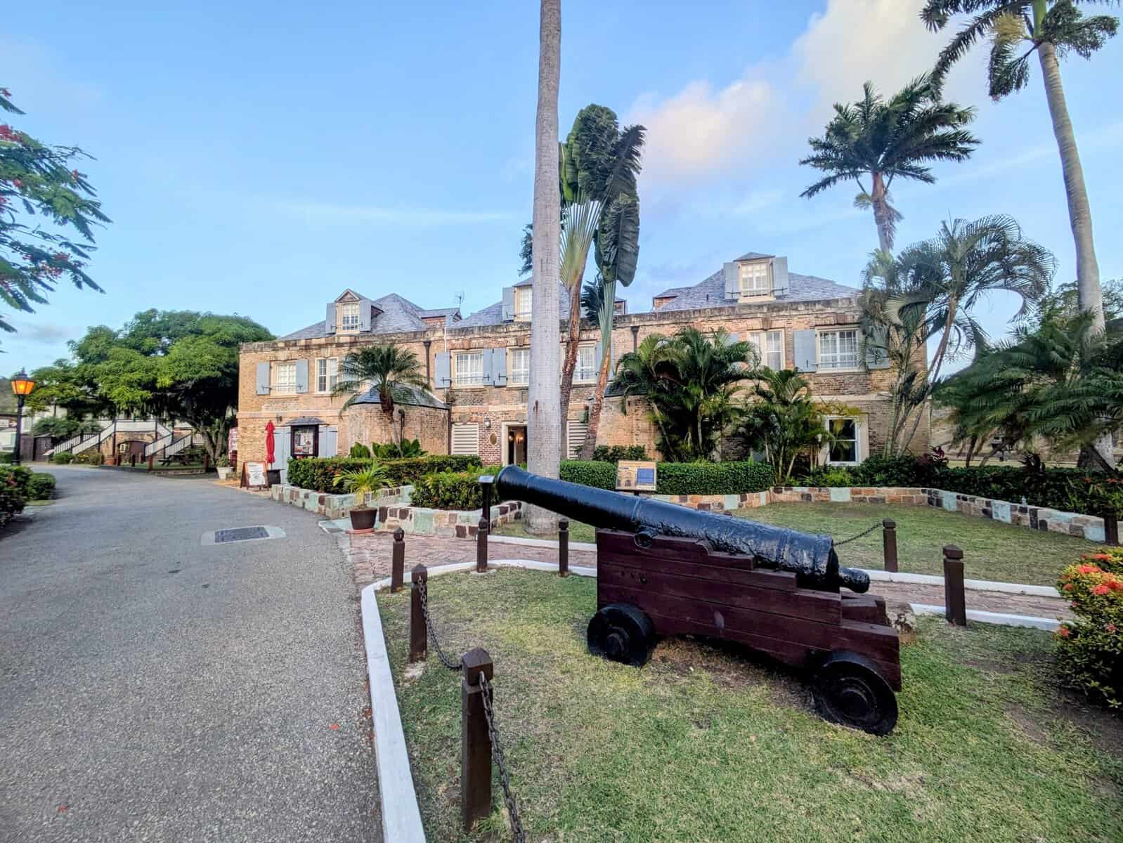 Nelson's dockyard with cannon in front of historic Copper & Lumber Store hotel in Antigua in the Caribbean