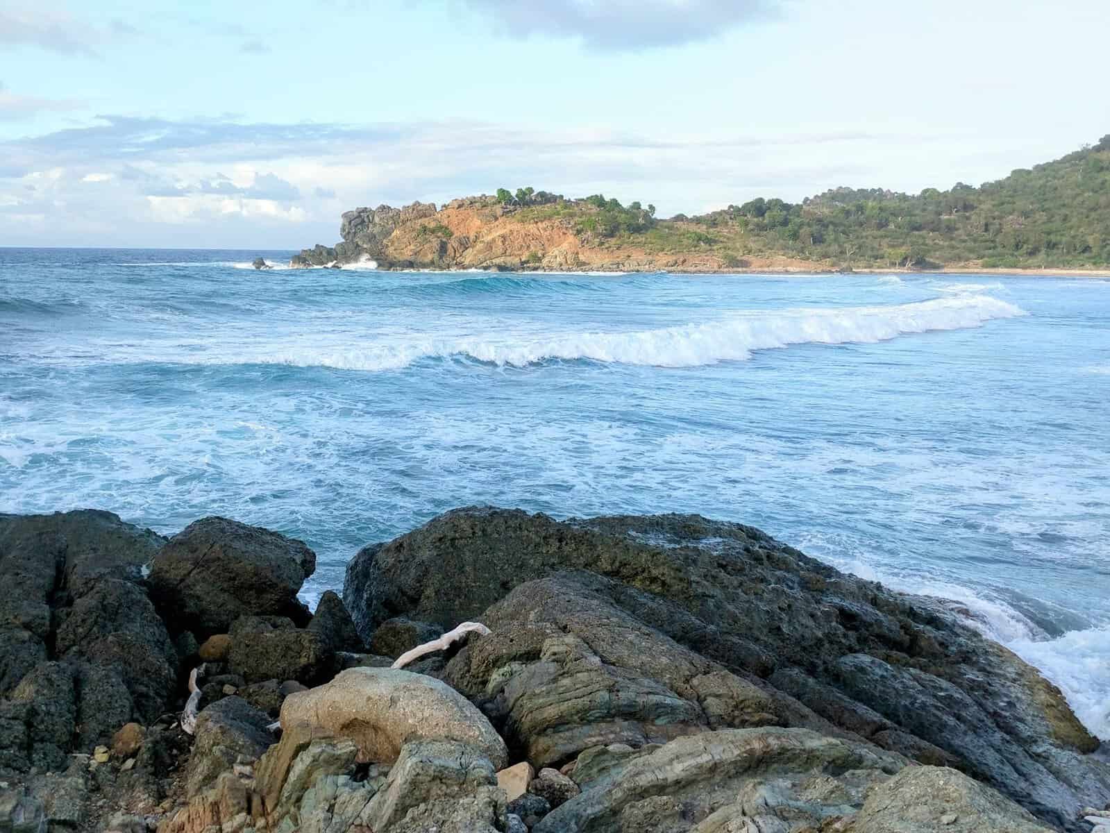 ocean waves rolling into Caribbean island in December