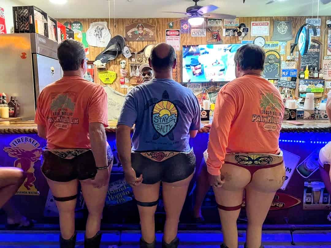 Cheeky bar stools at Corsairs, Great Harbour, Jost Van Dyke, British Virgin islands with paraphernalia posted on the walls